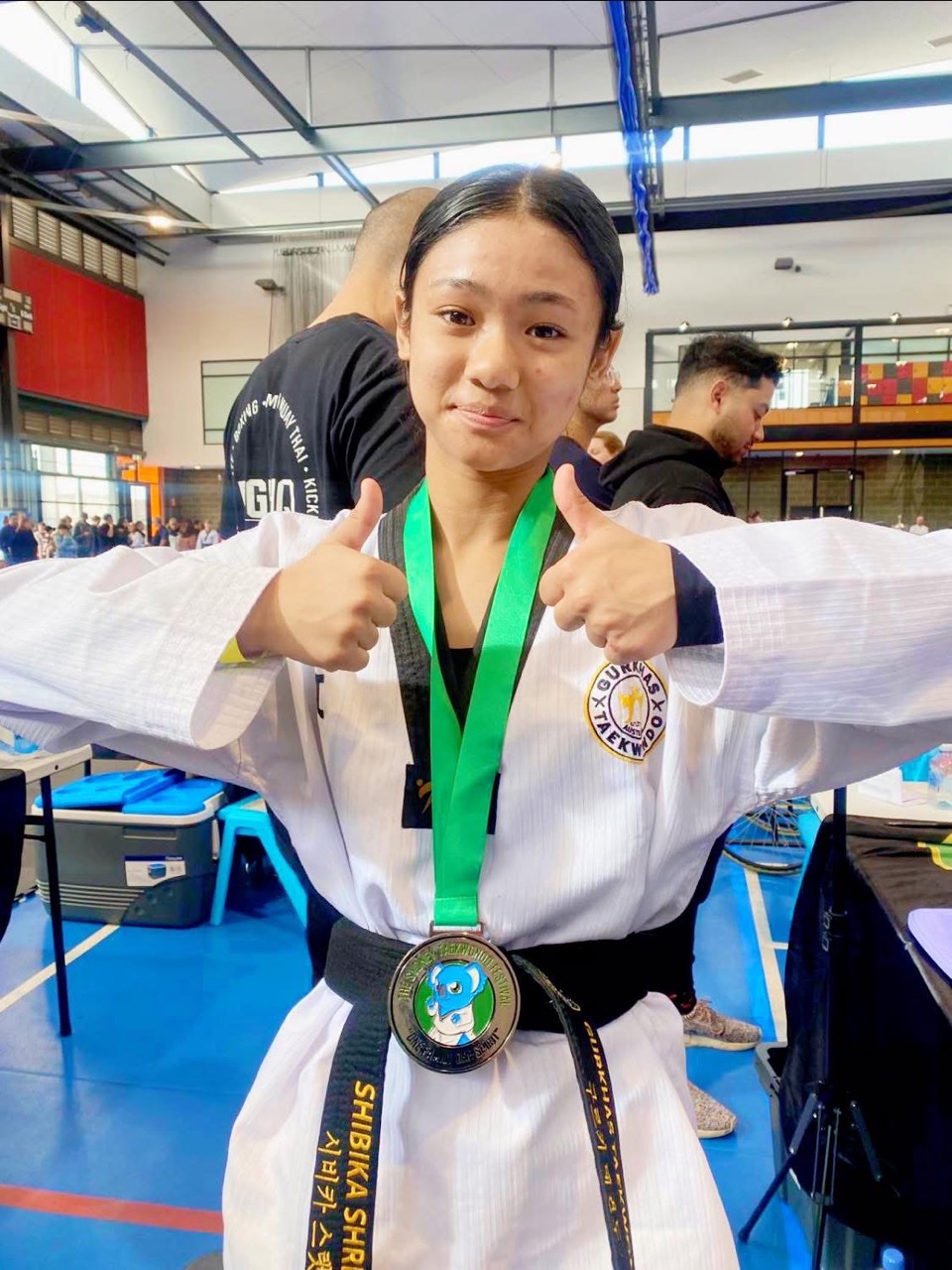 Gurkhas Taekwondo student celebrating with a medal