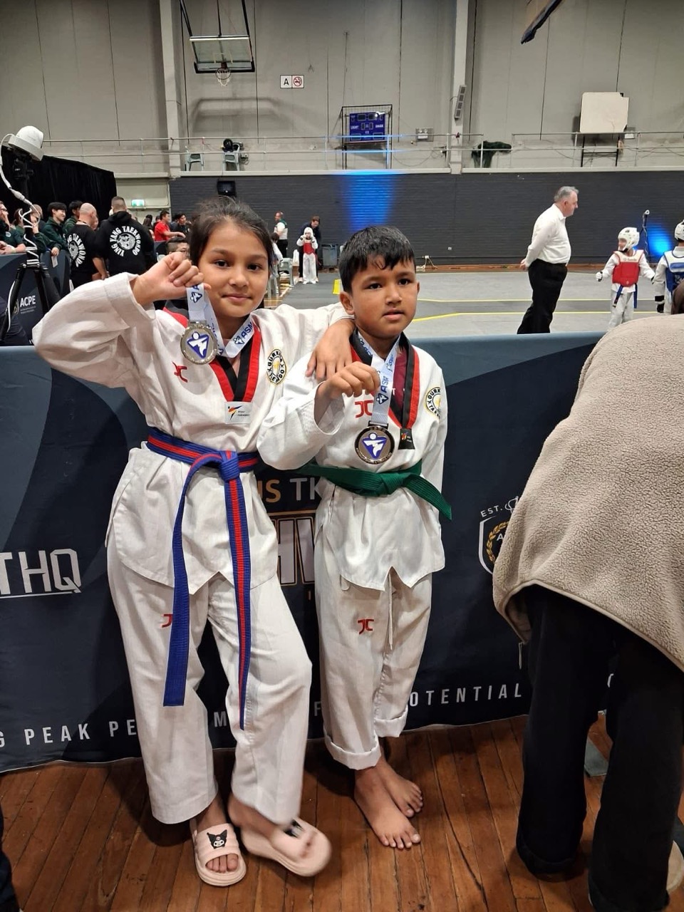 Young Gurkhas Taekwondo students showing their competition medals
